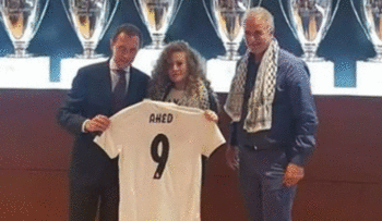 Ahed Tamimi, center, receiving a Real Madrid soccer jersey from Emilio Butragueño, August 29, 2018.